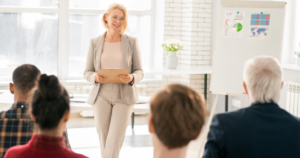 Woman leading a training session for a group of diverse professionals